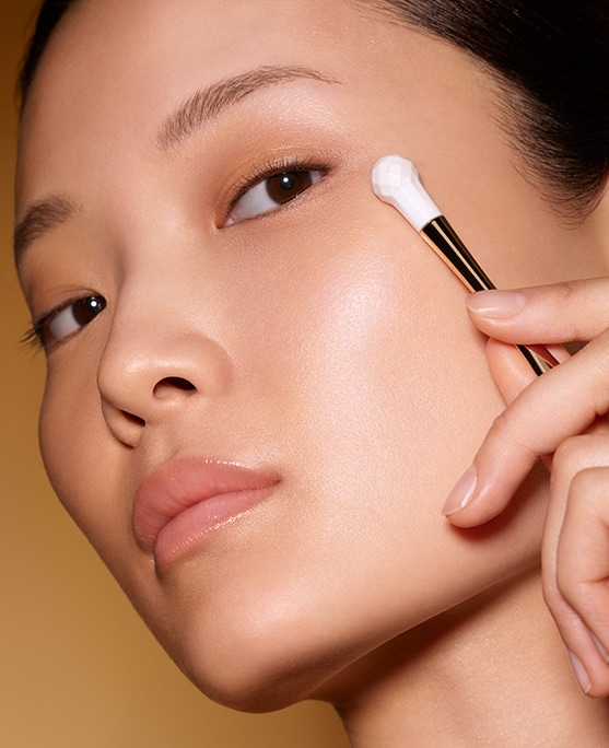 photo of woman applying re nutriv age reversal eye creme age reversal technique